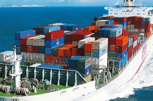 A large cargo ship with many containers on it.